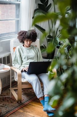 Professional using artificial intelligence tools on a laptop