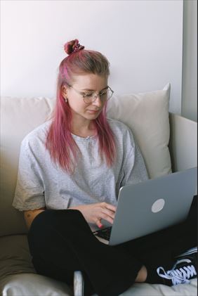 Professional freelancer working on a laptop in a modern workspace